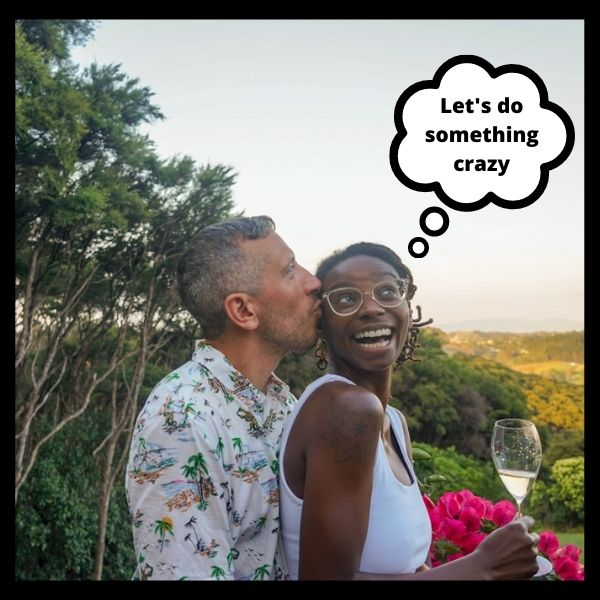 Diana and Frank with Champagne Outside and a thought bubble above them that says "Let's do something crazy"